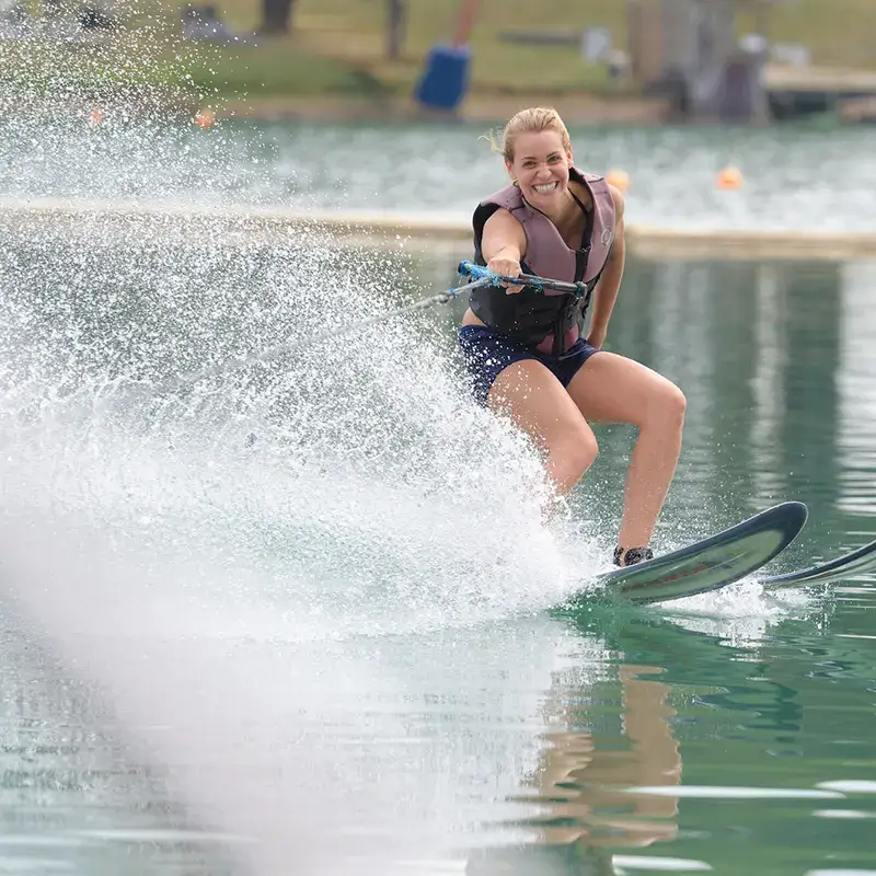 waterskier turning with spray