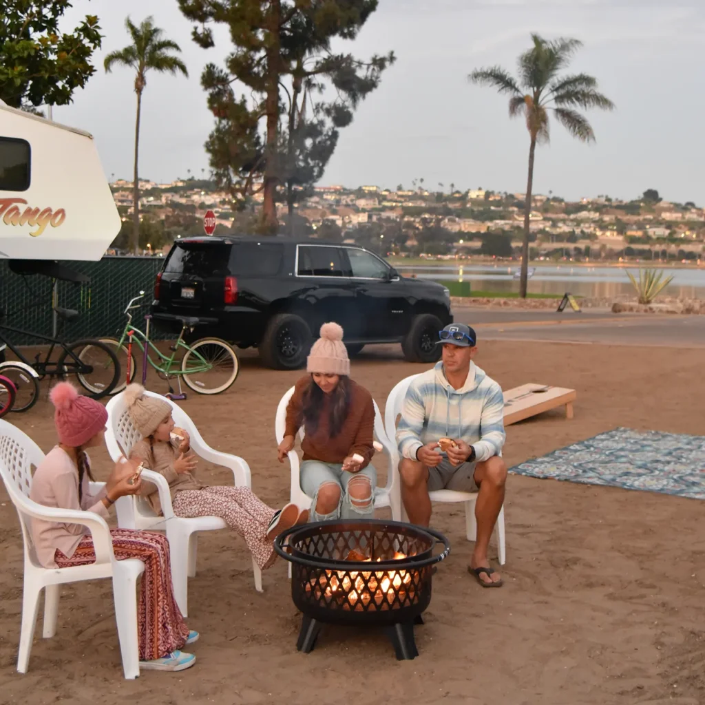 Family enjoying Campfire and s'mores at Mission Bay RV Resort